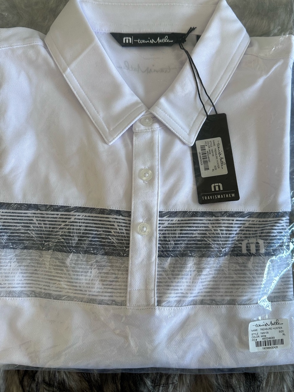 Travis Mathew “Treasure Hunter” White Polo with Gray Striped Palm Pattern